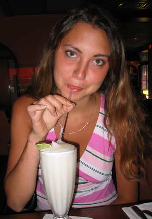 Yana drinking a margarita